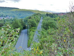 
Big Arch - The road to the right was the route of the line from Big Arch to the LNWR line past the slag crusher, which was on the right, the tramroad to Lasgarn followed the road to the left, June 2013.